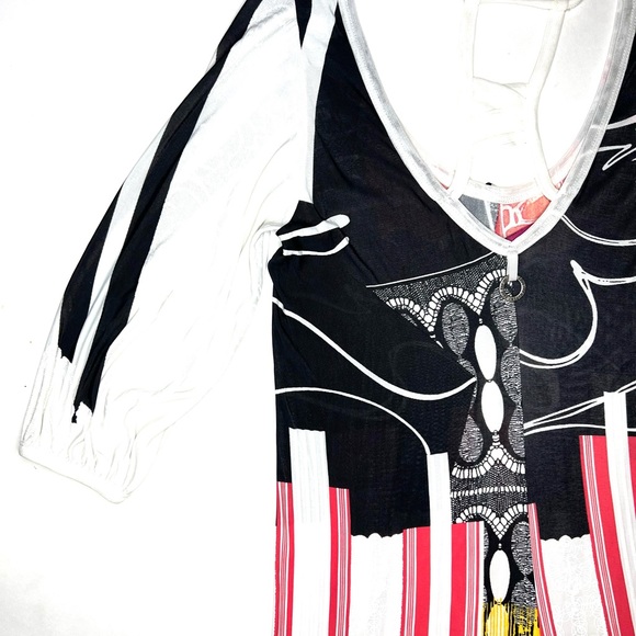 Save the Queen Ladies top. Medium Elbow length sleeves. Metal medallion accent. - Picture 13 of 13